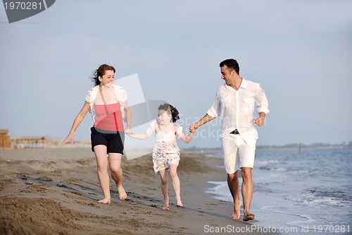 Image of happy young family have fun on beach
