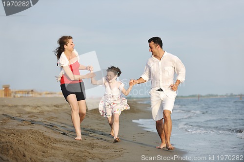 Image of happy young family have fun on beach