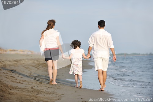 Image of happy young family have fun on beach