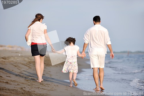 Image of happy young family have fun on beach