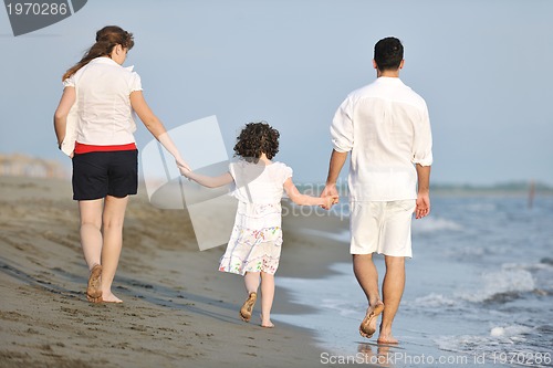 Image of happy young family have fun on beach