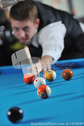 Image of young man play pro billiard game 