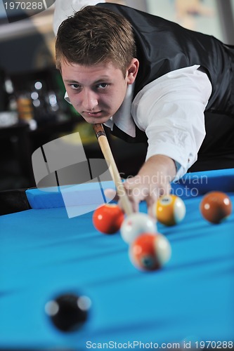 Image of young man play pro billiard game 