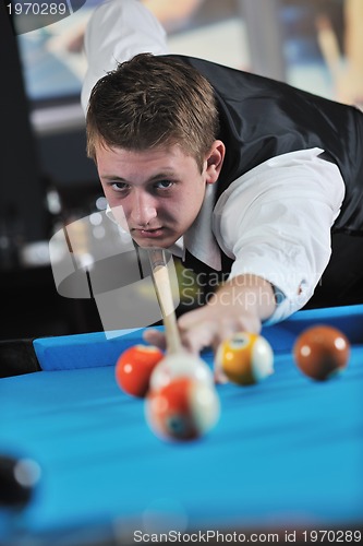 Image of young man play pro billiard game 