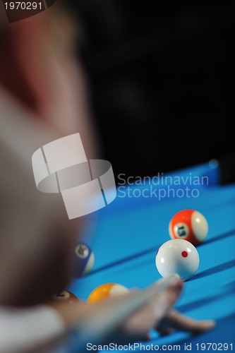 Image of young man play pro billiard game 