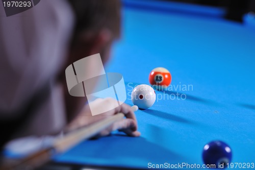 Image of young man play pro billiard game 