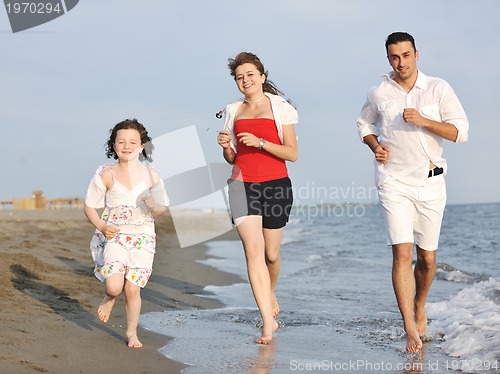 Image of happy young family have fun on beach