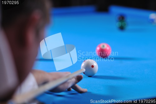 Image of young man play pro billiard game 