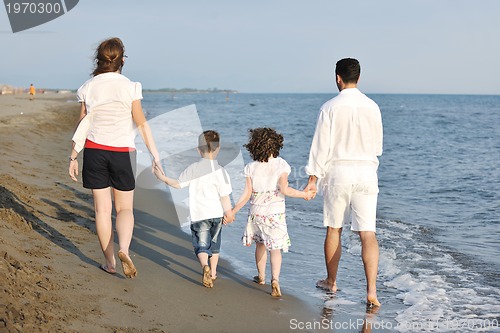 Image of happy young family have fun on beach