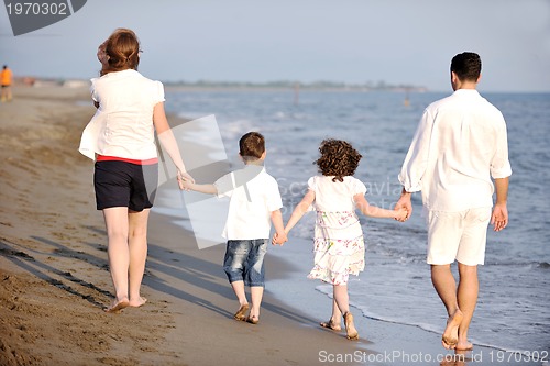 Image of happy young family have fun on beach