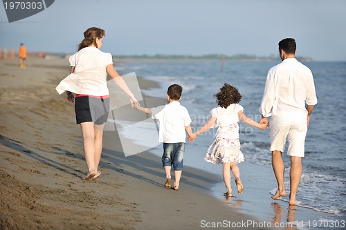 Image of happy young family have fun on beach