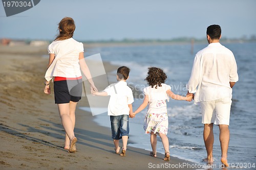 Image of happy young family have fun on beach
