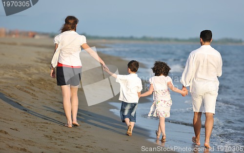 Image of happy young family have fun on beach