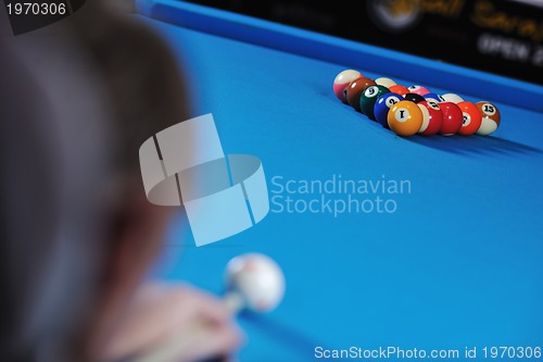 Image of young man play pro billiard game 