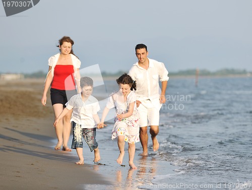 Image of happy young family have fun on beach