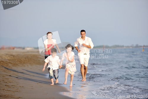 Image of happy young family have fun on beach