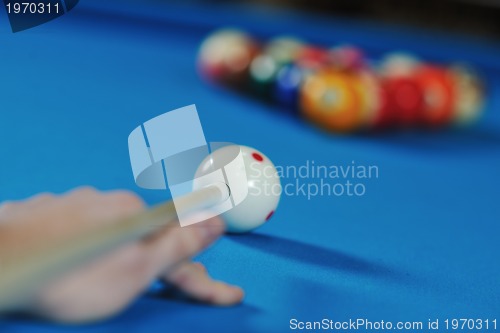 Image of young man play pro billiard game 