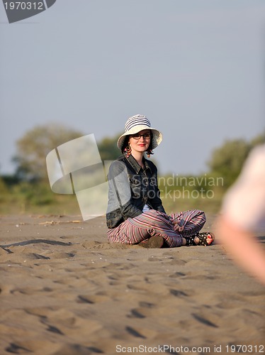 Image of young woman relax  on beach