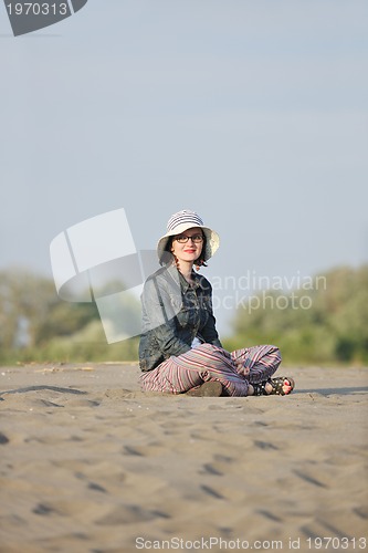 Image of young woman enjoy on beach