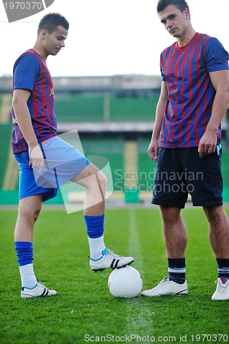 Image of football players in competition for the ball