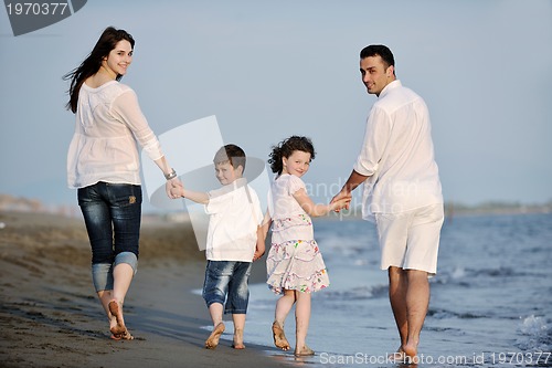 Image of happy young family have fun on beach
