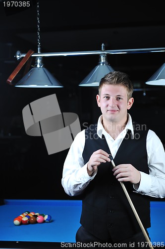 Image of young man play pro billiard game 