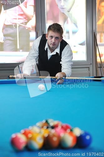 Image of young man play pro billiard game 