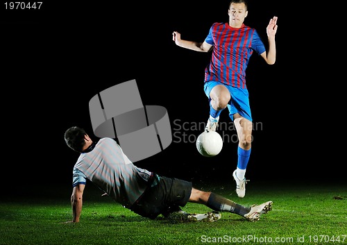 Image of football players in competition for the ball