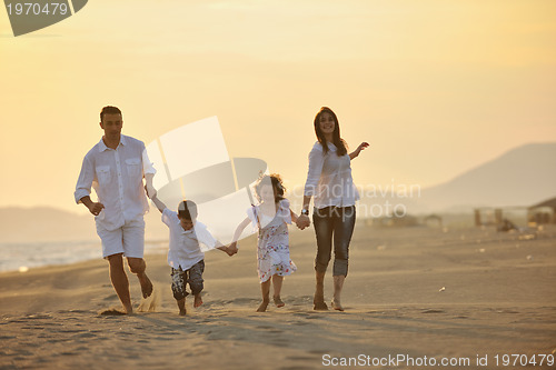 Image of happy young family have fun on beach