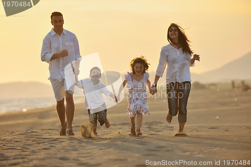 Image of happy young family have fun on beach
