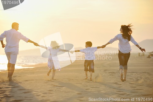 Image of happy young family have fun on beach