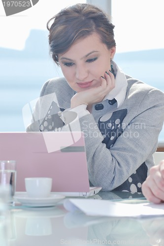 Image of young business woman on meeting