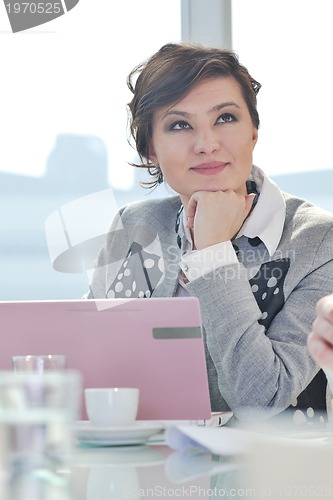 Image of young business woman on meeting