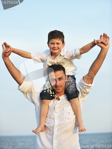 Image of happy young family have fun on beach