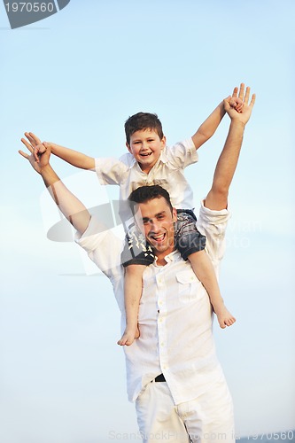 Image of happy young family have fun on beach