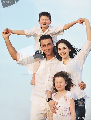 Image of happy young family have fun on beach