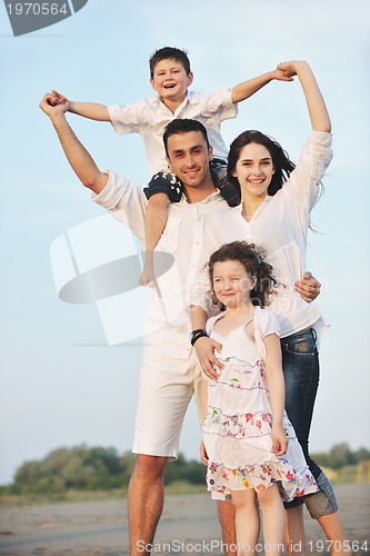 Image of happy young family have fun on beach
