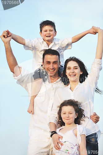 Image of happy young family have fun on beach