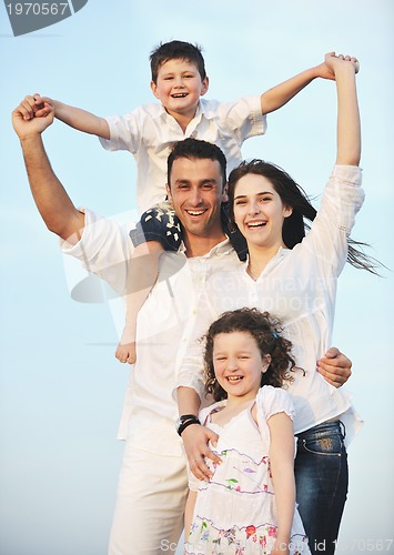 Image of happy young family have fun on beach