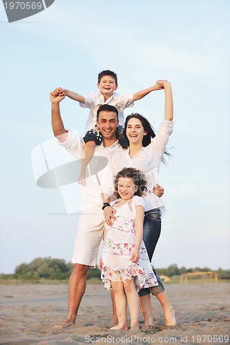 Image of happy young family have fun on beach