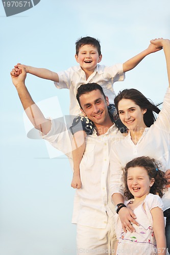 Image of happy young family have fun on beach