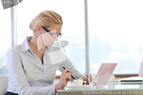 Image of young business woman on meeting