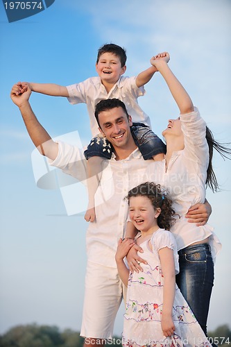Image of happy young family have fun on beach
