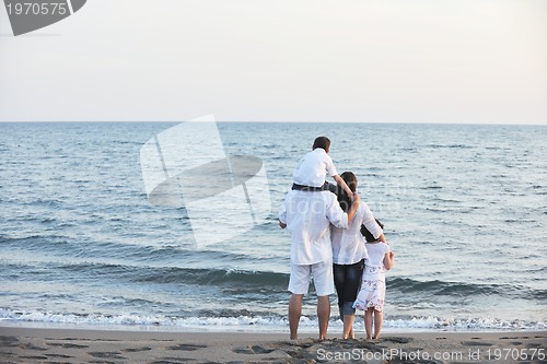 Image of happy young family have fun on beach