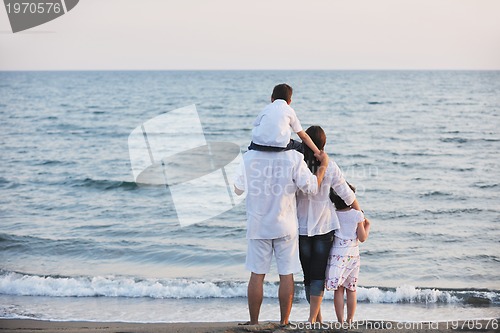 Image of happy young family have fun on beach