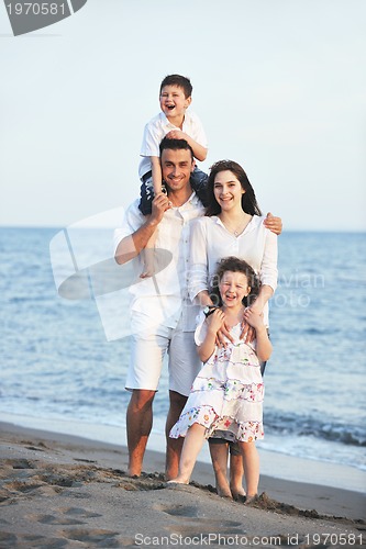 Image of happy young family have fun on beach