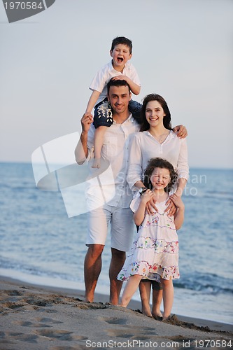 Image of happy young family have fun on beach