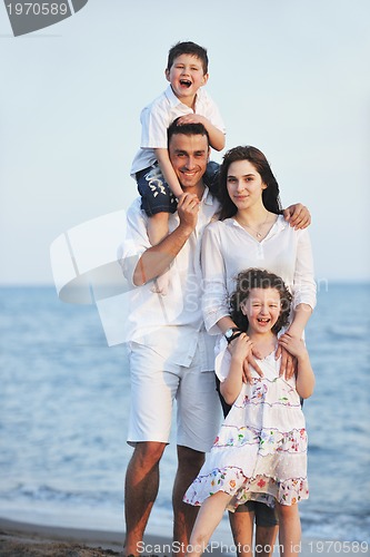 Image of happy young family have fun on beach