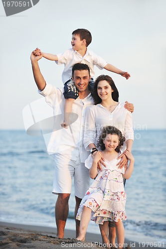 Image of happy young family have fun on beach