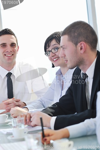 Image of group of business people at meeting